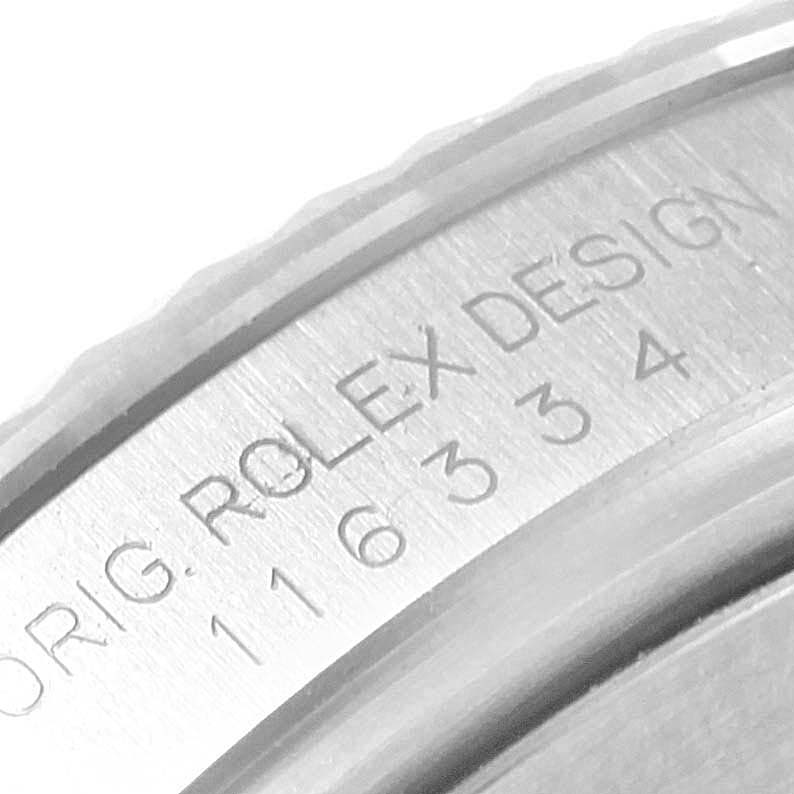 This image shows a close-up of the engraved inner bezel of a Rolex Datejust 41 116334 Men
s Stainless Steel Blue Dial 116334 Men
s Stainless Steel Blue Dial watch with the model number visible.