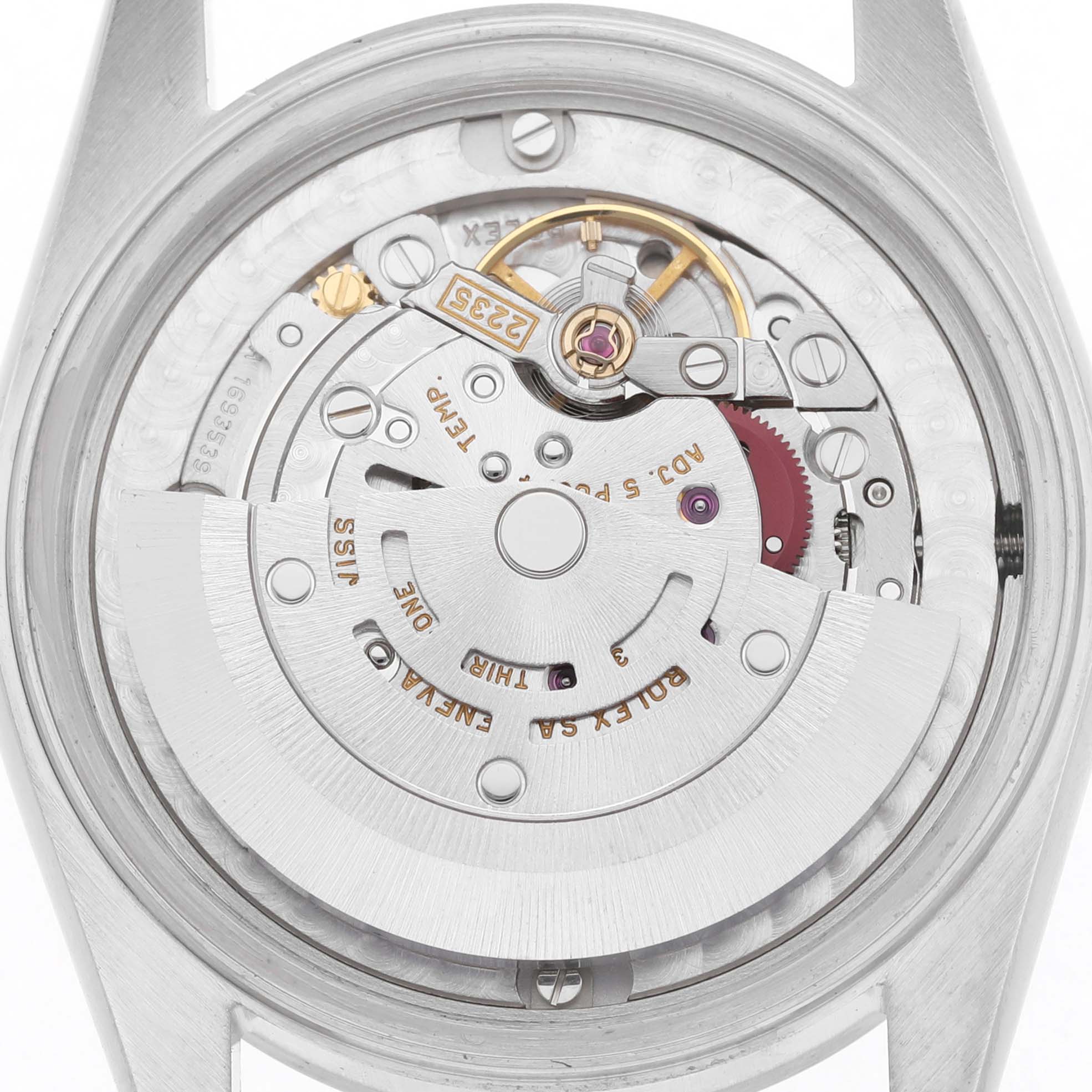 The image shows the movement of a Rolex Datejust 78274 Men's Stainless Steel Black Dial watch from a top-down angle, highlighting the rotor and mechanical components.