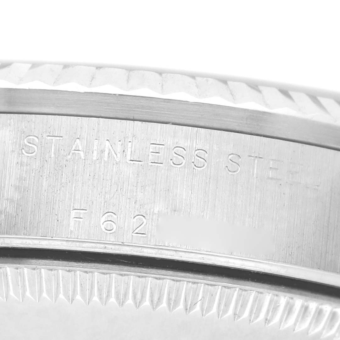 The image shows a close-up of the case side of a Rolex Datejust 78274 Men's Stainless Steel Black Dial watch, highlighting the engraved stainless steel marking.