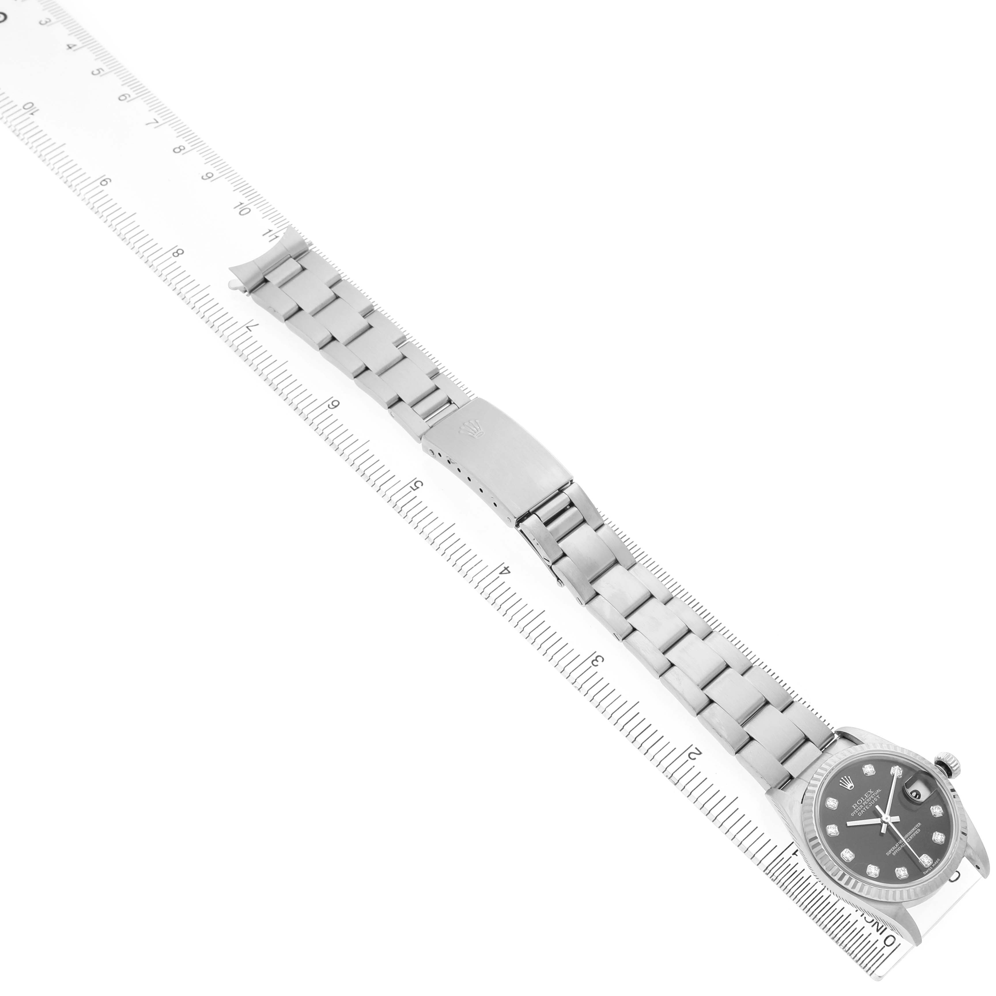 The Rolex Datejust 78274 Men's Stainless Steel Black Dial watch is shown diagonally with its full bracelet, clasp, and case visible.