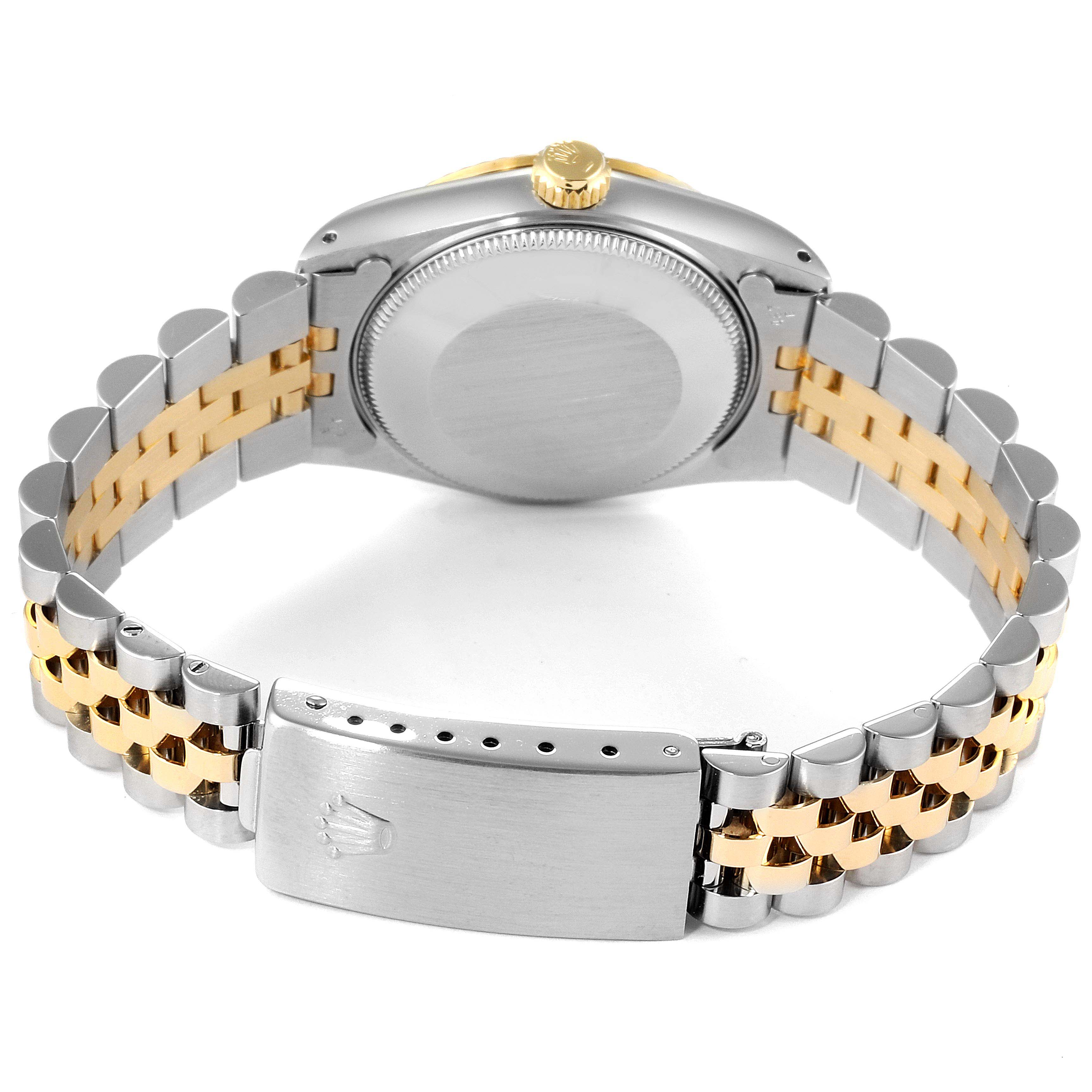 The image shows the back view of a Mid-Size Rolex watch, highlighting the case back, bracelet, and clasp.