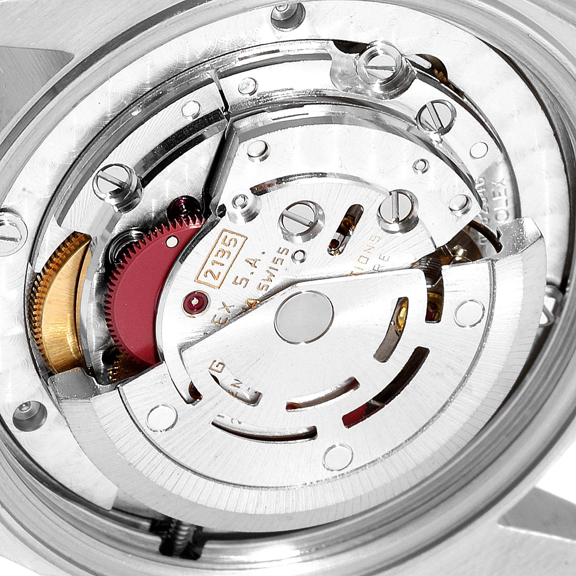 This image shows a close-up view of the movement mechanism of a Mid-Size Rolex watch.