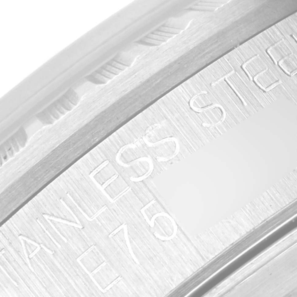 This image shows a close-up angle of the stainless steel engraving on a Rolex Datejust 16220 Men's Stainless Steel Silver Dial 16220 Men's Stainless Steel Silver Dial watch.