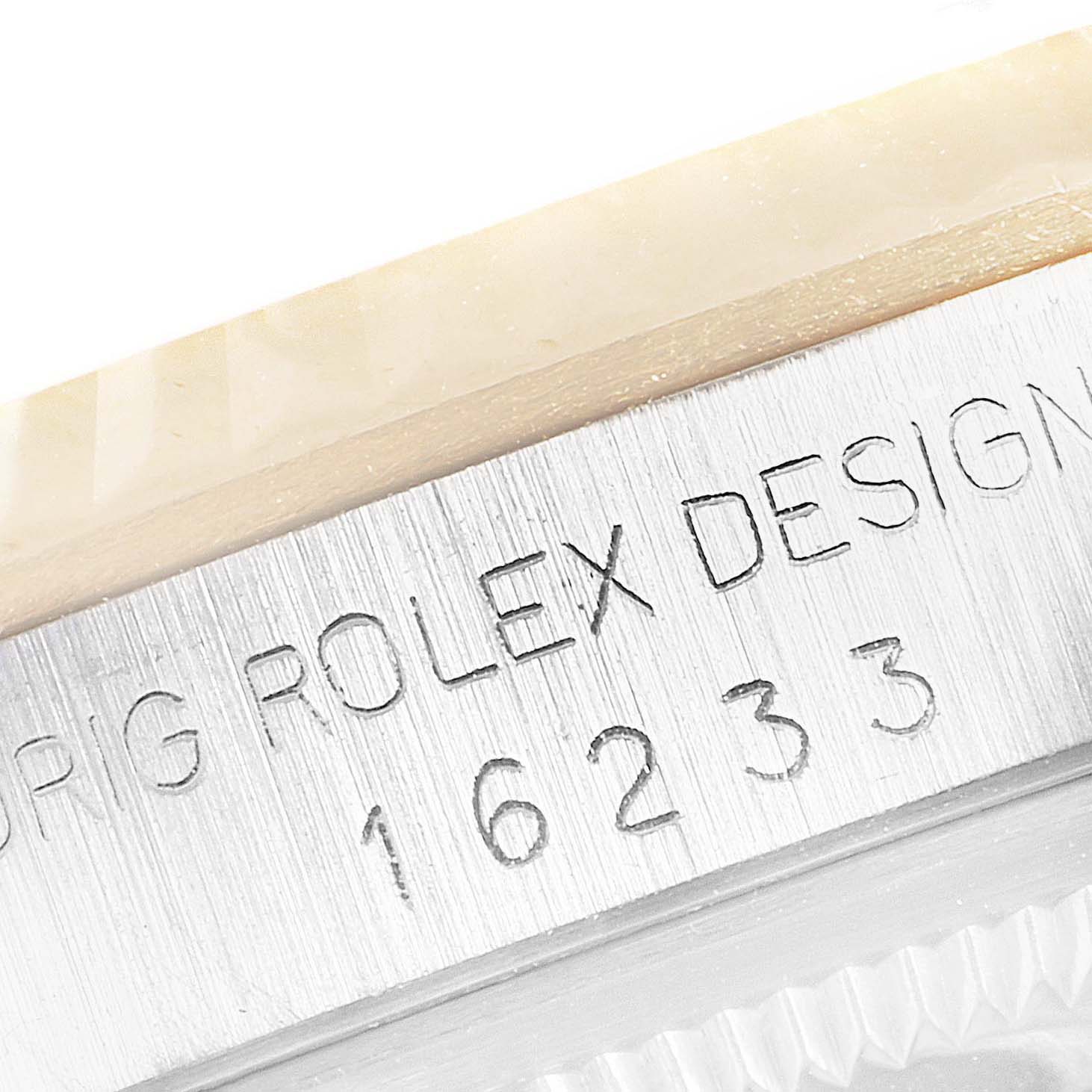 This close-up shows the model number engraving on the case of a Rolex Datejust 16233 Men's Steel and Gold (two tone) Champagne Dial 16233 Men's Steel and Gold (two tone) Champagne Dial watch.