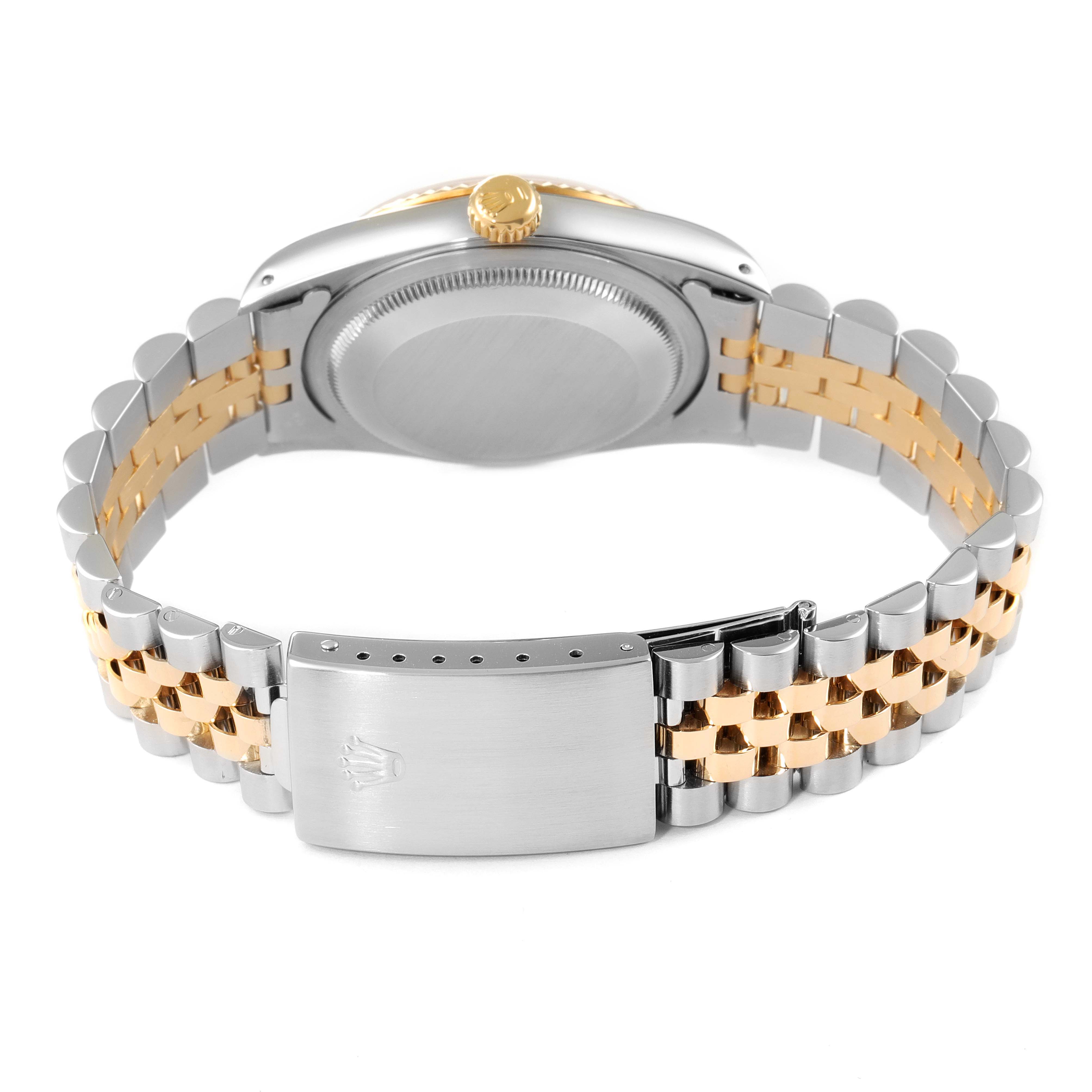 The image shows the back and clasp of a Rolex Datejust 16233 Men's Steel and Gold (two tone) Champagne Dial 16233 Men's Steel and Gold (two tone) Champagne Dial watch, showcasing the two-tone bracelet and case back.