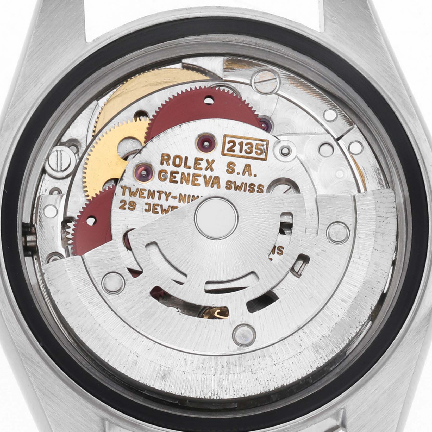 The image shows the inner movement of a Rolex Datejust 69174 Women
s Stainless Steel Blue Dial 69174 Women
s Stainless Steel Blue Dial watch from a top-down angle, highlighting the gears and inscriptions.