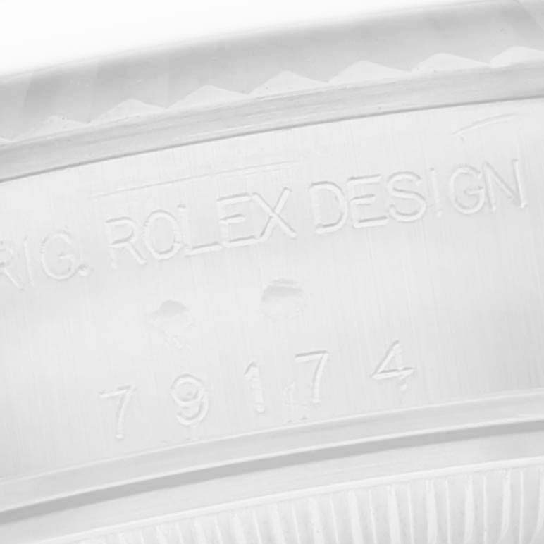 The image shows a close-up of the inner case engraving with the model number "79174" for the Rolex Datejust 79174 Women
s Stainless Steel Silver Dial 79174 Women
s Stainless Steel Silver Dial.