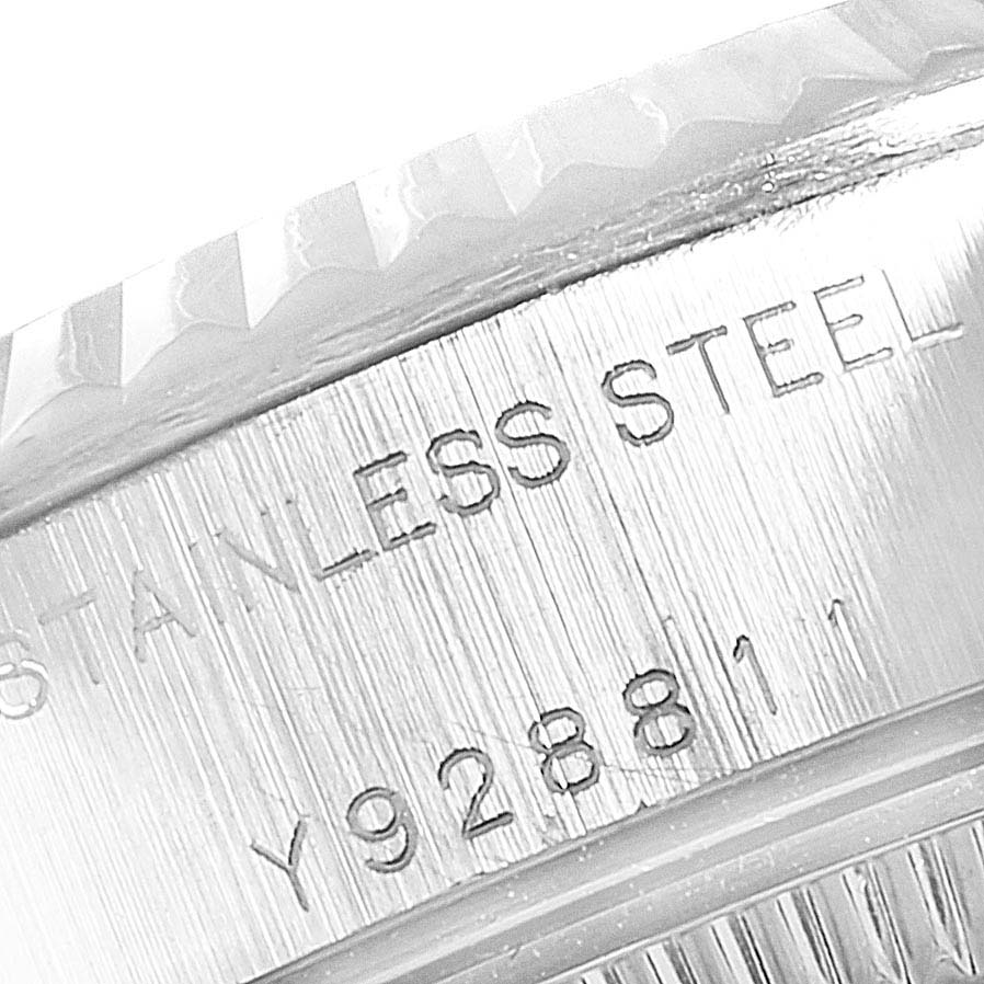 This close-up image shows the engraving on the side of the bezel and case of a Rolex Datejust 79174  Women
s Stainless Steel Silver Dial 79174  Women
s Stainless Steel Silver Dial watch.