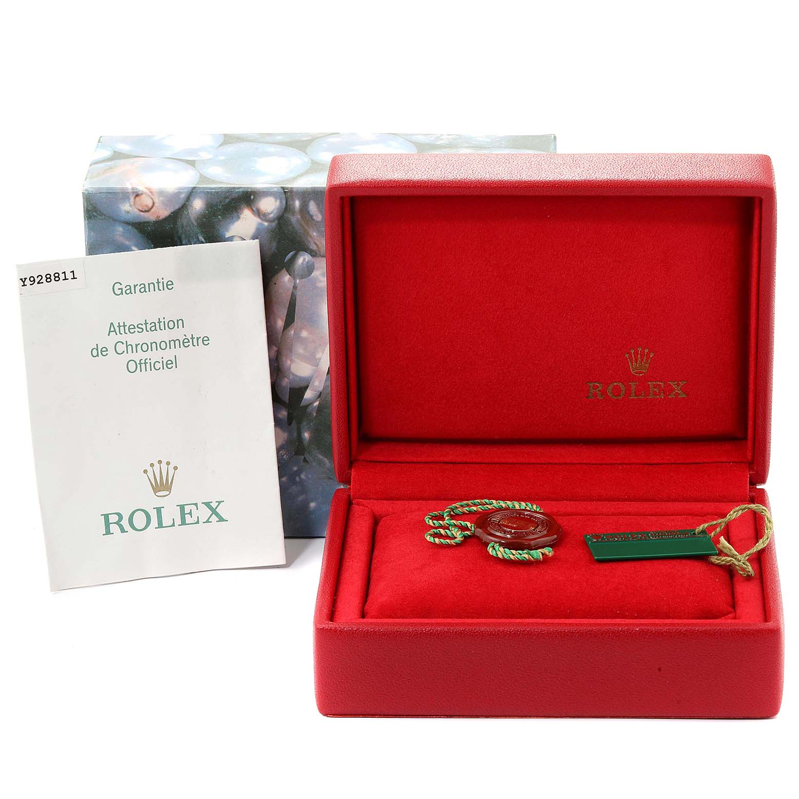 The image shows an open Rolex Datejust 79174  Women
s Stainless Steel Silver Dial 79174  Women
s Stainless Steel Silver Dial box with tags and a warranty document placed beside it.