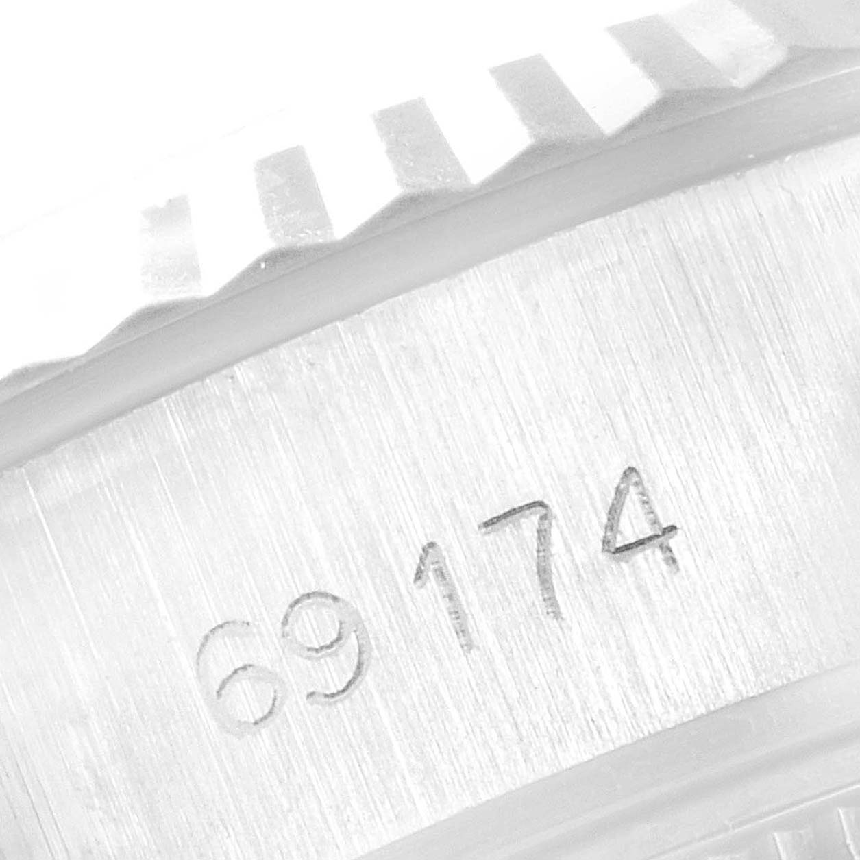 This image shows a close-up view of the reference number "69174" on the casing of a Rolex Datejust 69174 Women
s Stainless Steel Silver Dial 69174 Women
s Stainless Steel Silver Dial watch.