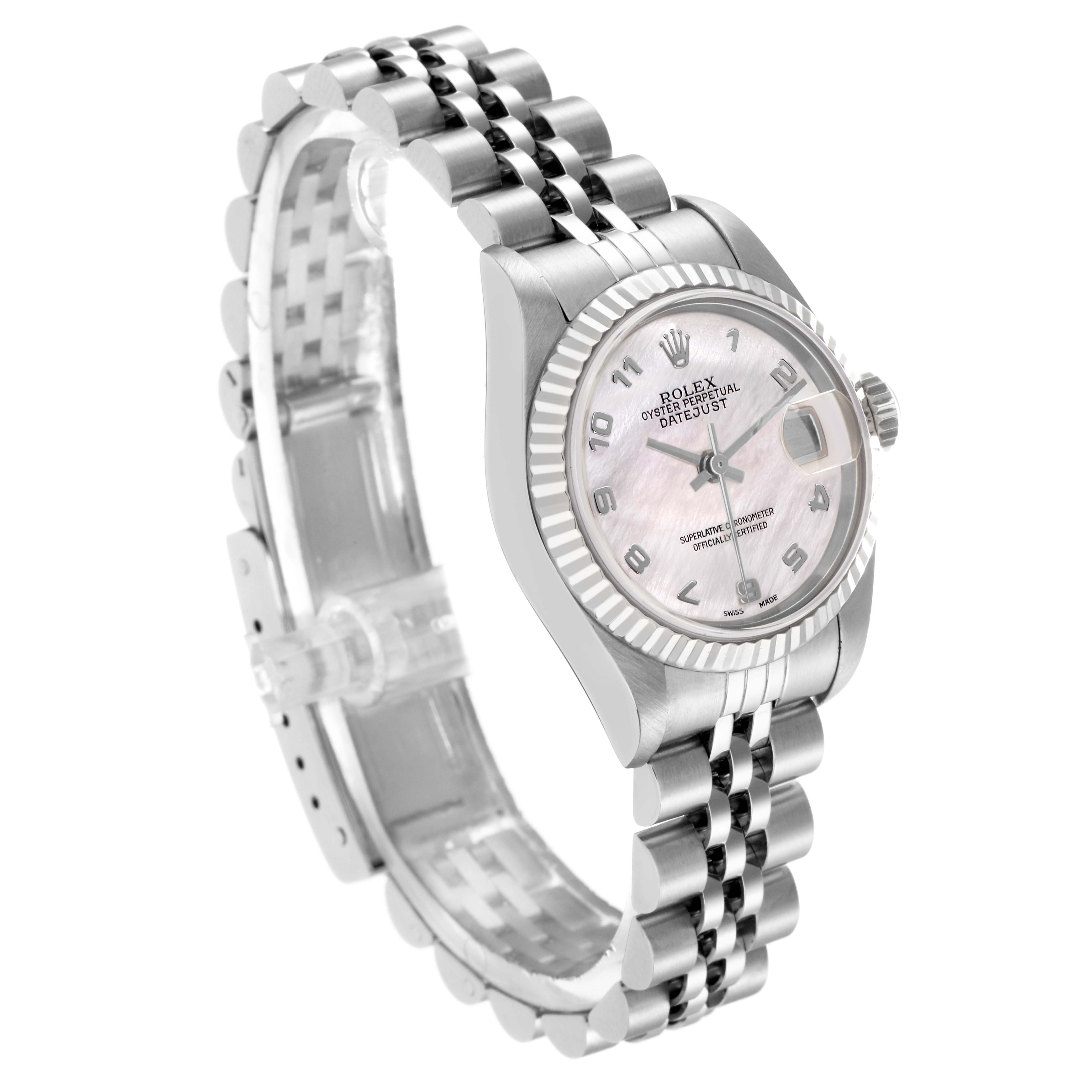 The Rolex Datejust 79174 Women
s Stainless Steel Mother of Pearl Dial 79174 Women
s Stainless Steel Mother of Pearl Dial watch is shown at a tilted angle, highlighting the face, fluted bezel, and Jubilee bracelet.