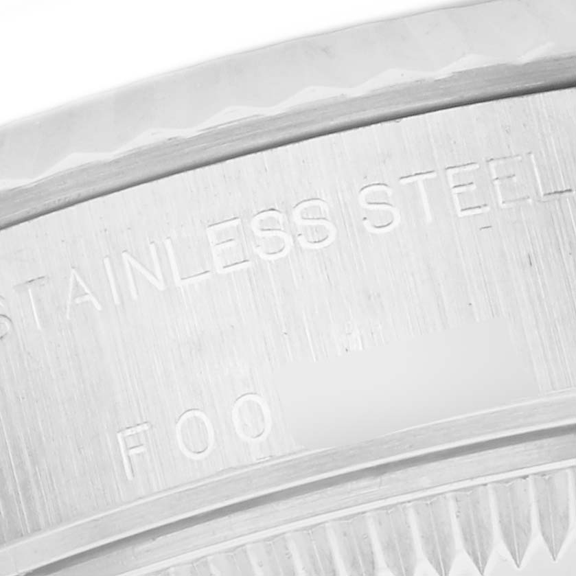 The image shows a close-up of the case back engraving on a Rolex Datejust 79174 Women
s Stainless Steel Mother of Pearl Dial 79174 Women
s Stainless Steel Mother of Pearl Dial, highlighting the "Stainless Steel" marking.