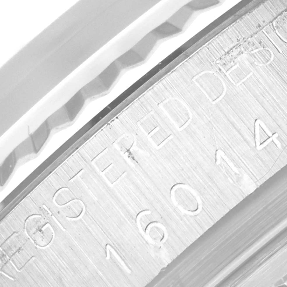 This close-up image shows the engraved rim and partial bezel of the Rolex Datejust 16014 Men's Stainless Steel Silver Dial 16014 Men's Stainless Steel Silver Dial model.