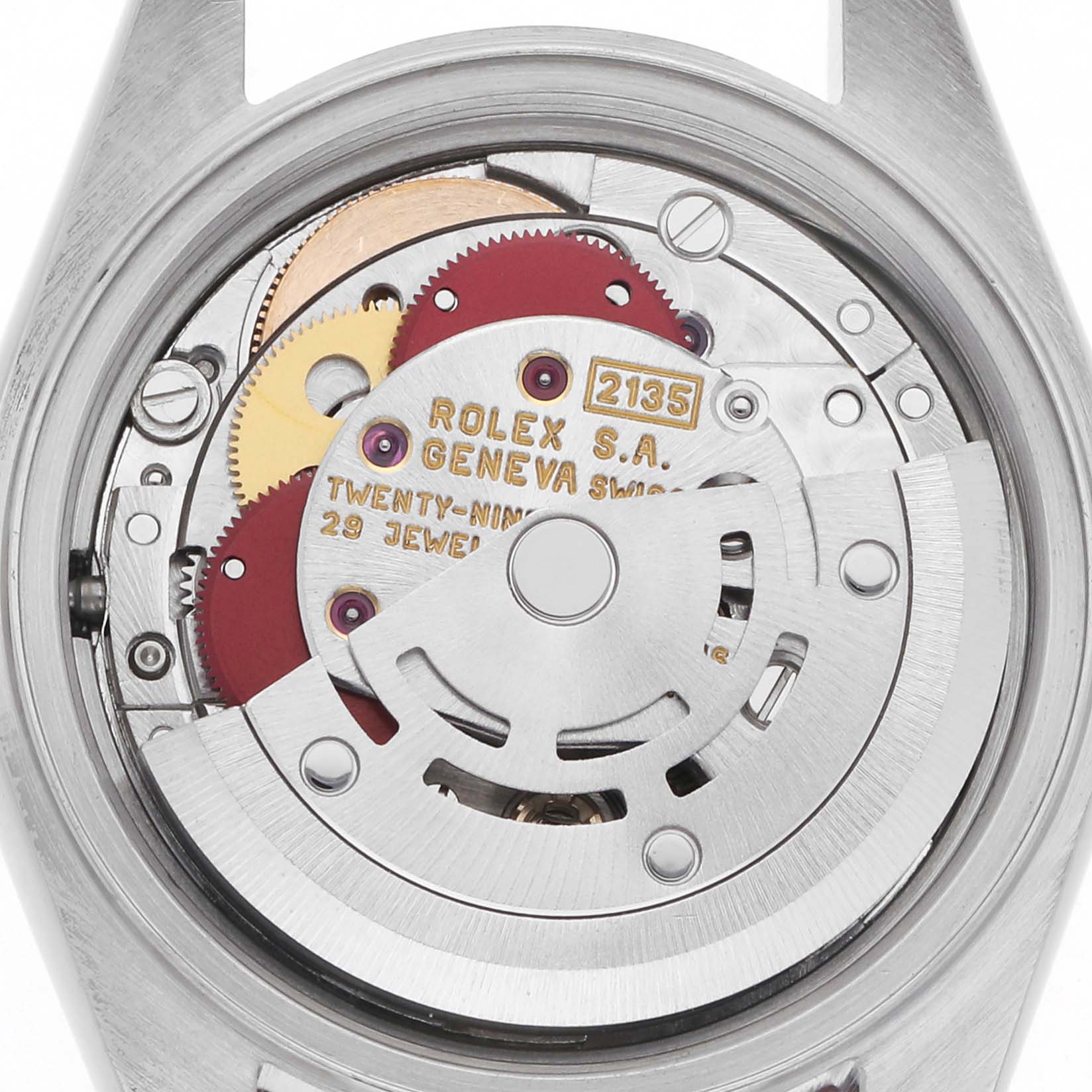 The image shows the movement components of a Rolex Datejust 69173 Women
s Steel and Gold (two tone) Champagne Dial 69173 Women
s Steel and Gold (two tone) Champagne Dial watch from a back view, highlighting the gears and engravings.