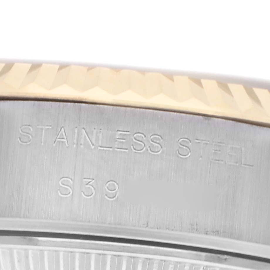 The image shows a close-up of the stainless steel side of the bezel on a Rolex Datejust 69173 Women
s Steel and Gold (two tone) Champagne Dial 69173 Women
s Steel and Gold (two tone) Champagne Dial watch.