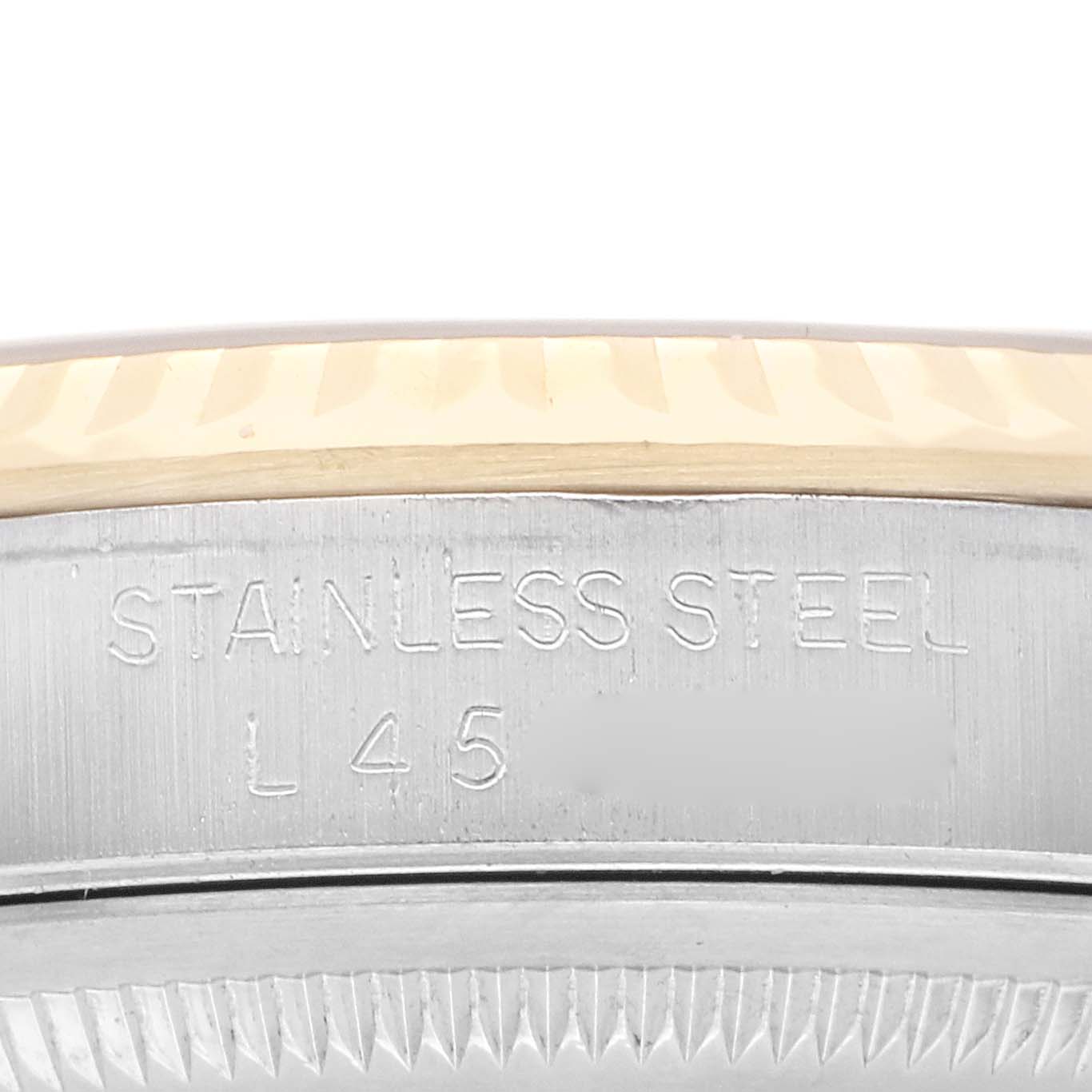 The image shows a close-up of the bezel and case side of a Rolex Datejust 16233 Men
s Steel and Gold (two tone) Champagne Dial 16233 Men
s Steel and Gold (two tone) Champagne Dial, highlighting the stainless steel material.