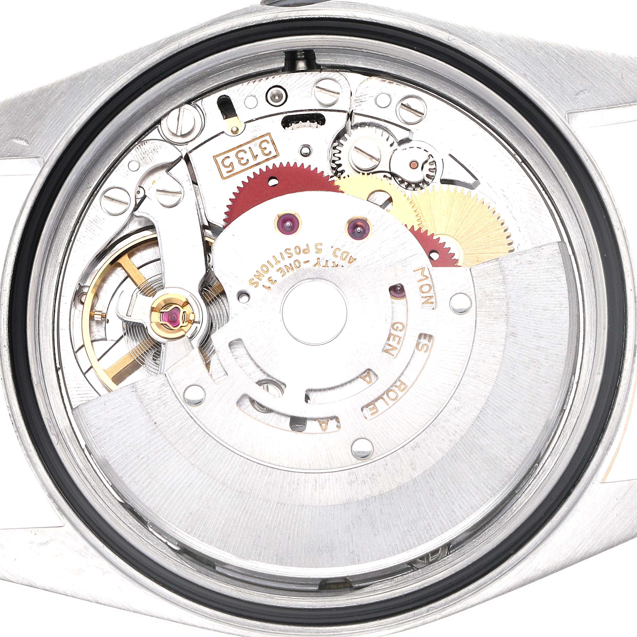 The image shows the inner mechanism of a Rolex Datejust 16233 Men
s Steel and Gold (two tone) Champagne Dial 16233 Men
s Steel and Gold (two tone) Champagne Dial watch from a top-down view, highlighting gears and the rotor.