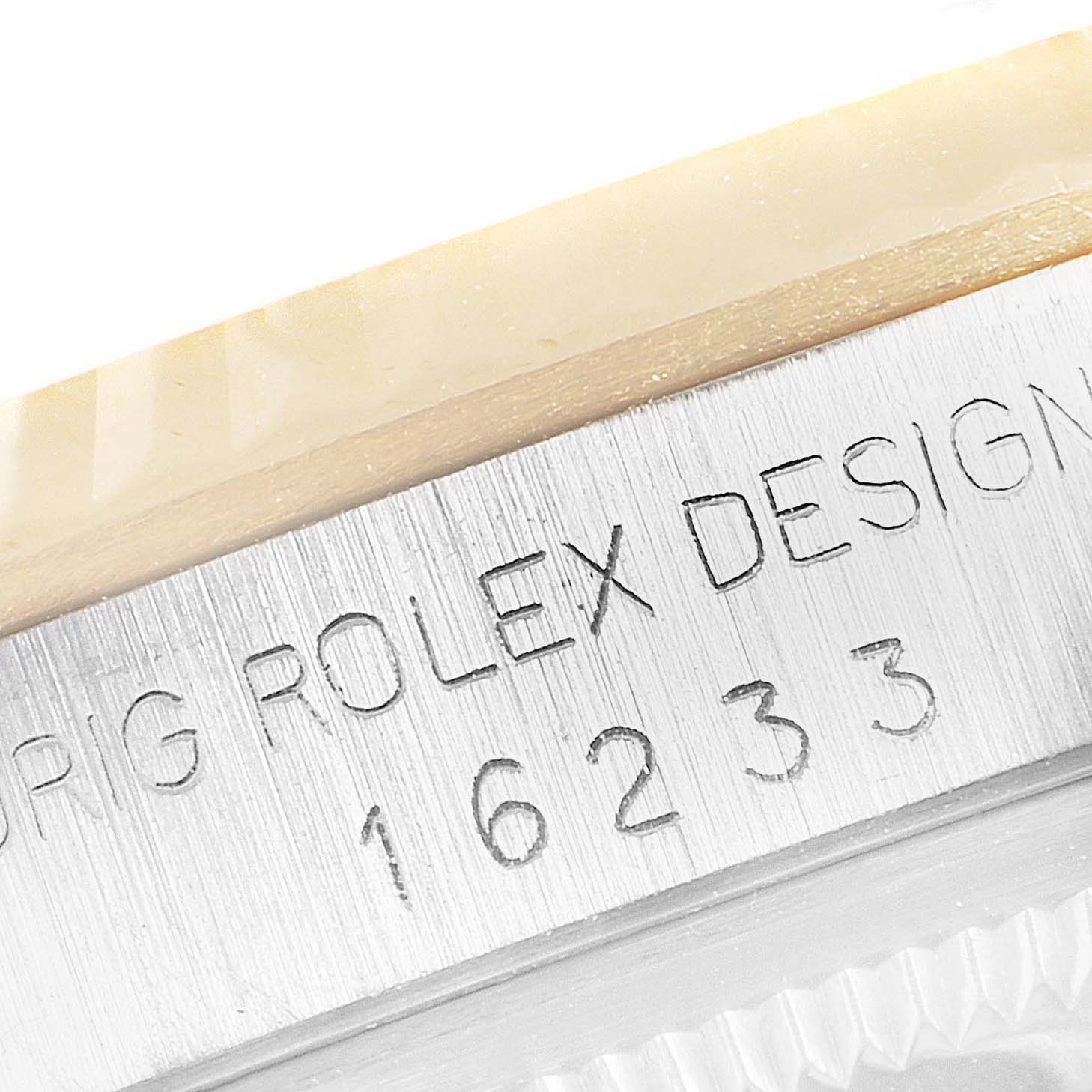 The image shows a close-up of the Rolex Datejust 16233 Men's Steel and Gold (two tone) Champagne Dial 16233 Men's Steel and Gold (two tone) Champagne Dial model, displaying its bezel edge and model number engraving.