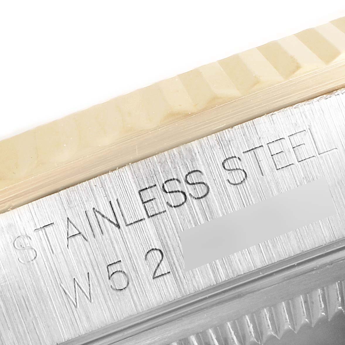 The image shows a close-up of the stainless steel bezel and outer rim of the Rolex Datejust 16233 Men's Steel and Gold (two tone) Champagne Dial 16233 Men's Steel and Gold (two tone) Champagne Dial watch.