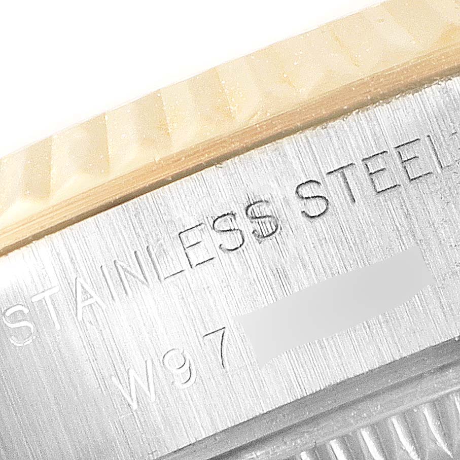 The image shows a close-up of the outer case of a Rolex Datejust 69173 Women's Stainless Steel Grey Dial 69173 Women's Stainless Steel Grey Dial watch, highlighting the "STAINLESS STEEL" engraving.