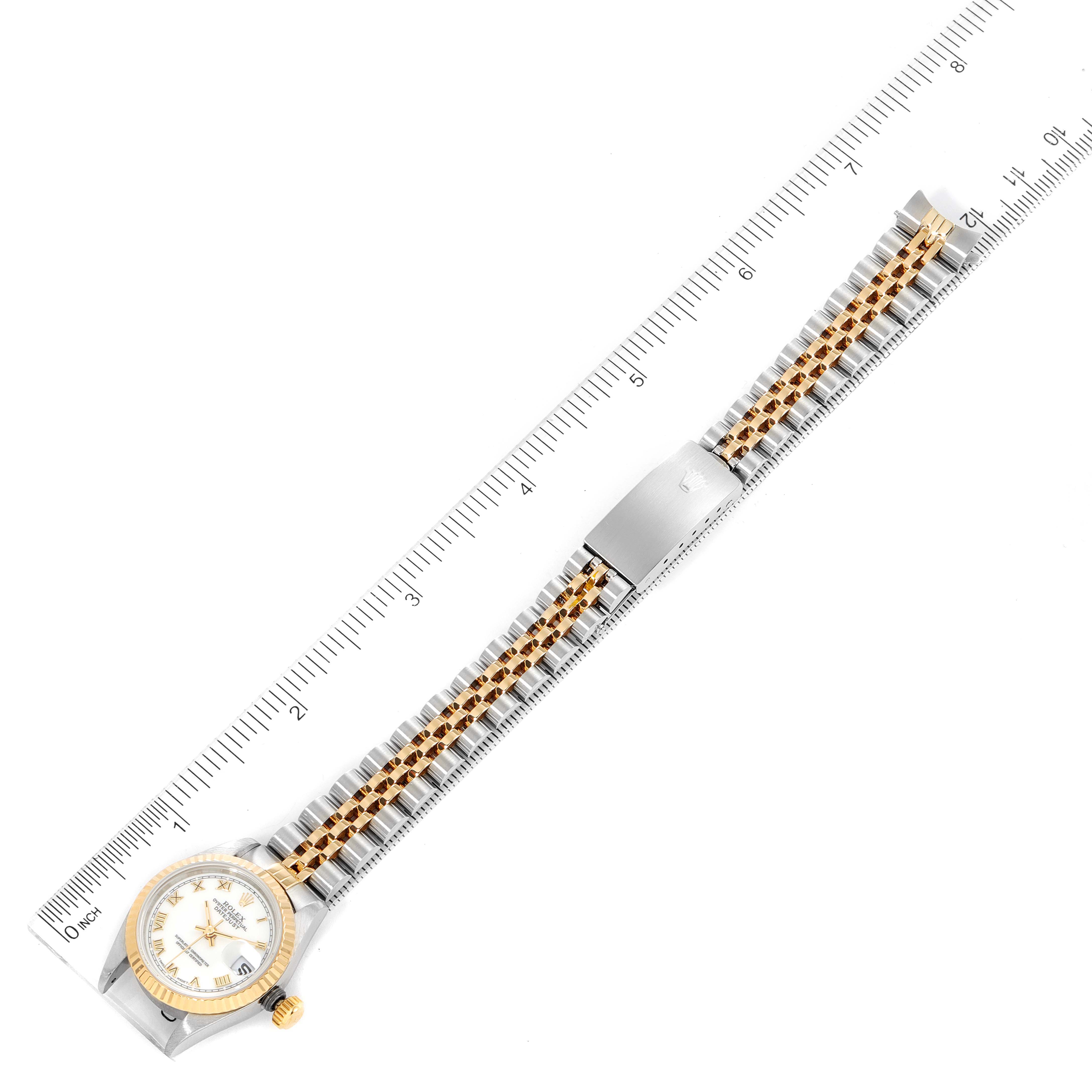 The image shows a top-down view of a Rolex Datejust 69173 Women's Steel and Gold (two tone) White Dial 69173 Women's Steel and Gold (two tone) White Dial watch with a ruler beside it for scale.