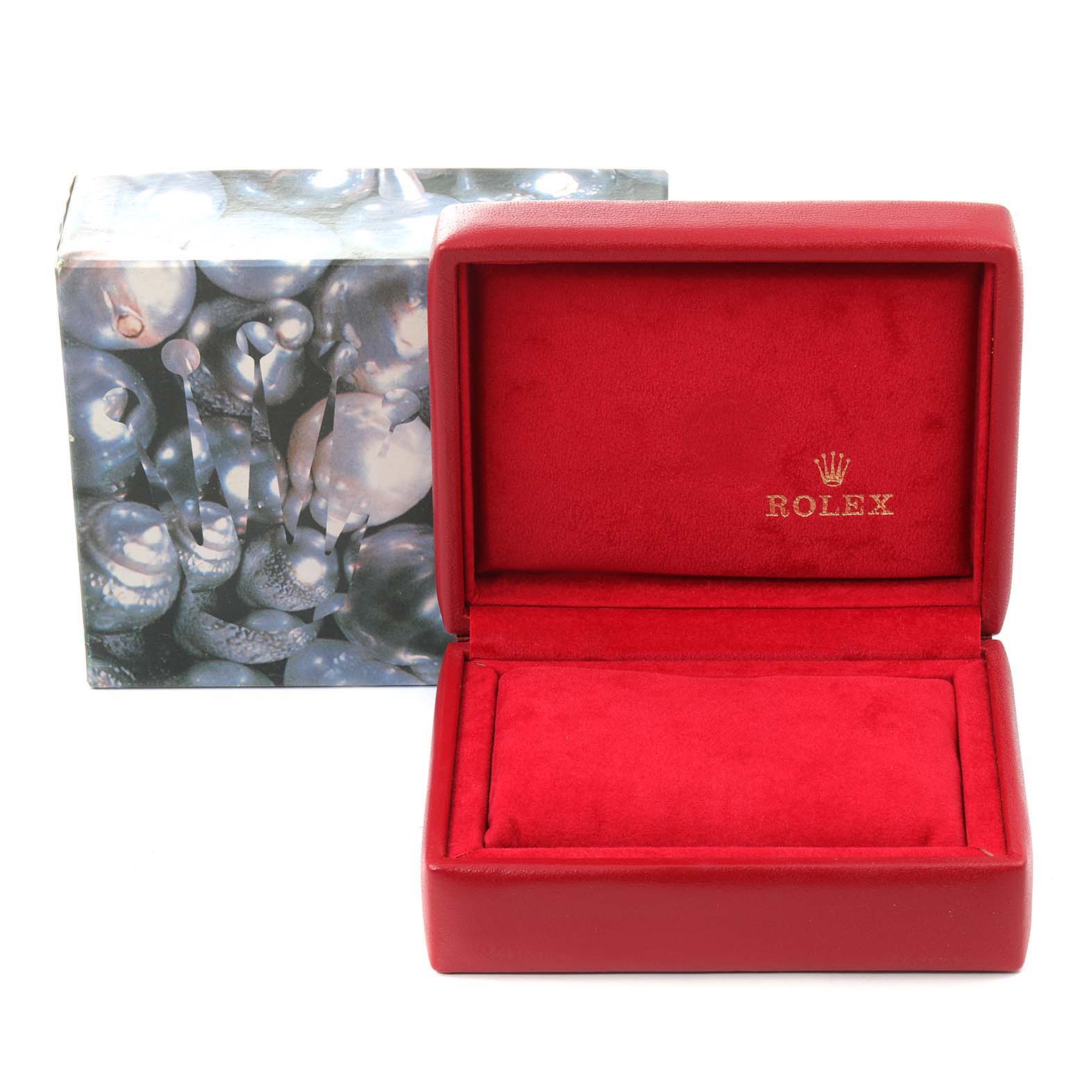 The image shows a Rolex watch box and outer packaging for the Datejust model, with the box open to reveal a red interior.