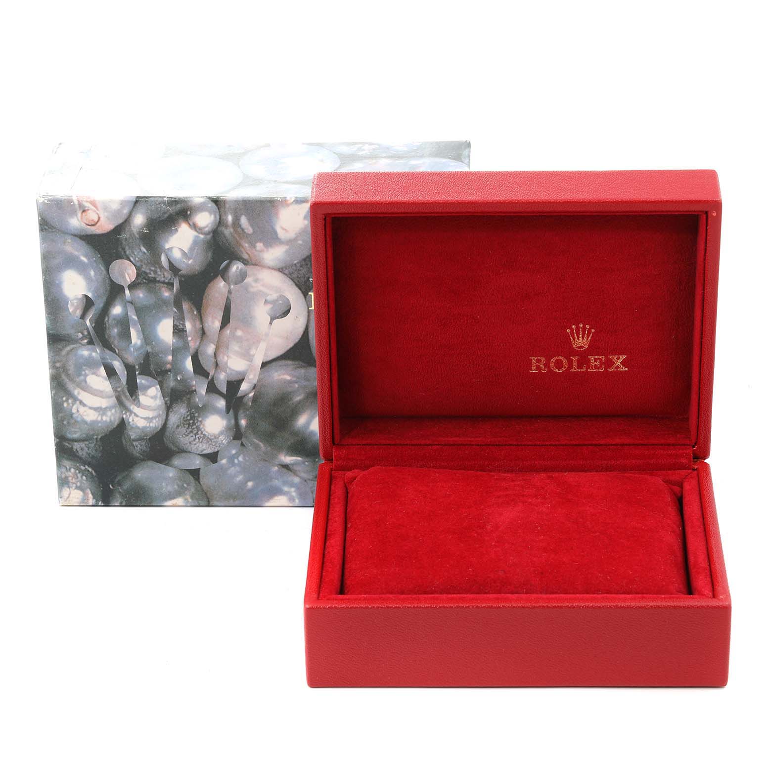 The image shows a Rolex Datejust 79173 Women
s Steel and Gold (two tone) Champagne Dial 79173 Women
s Steel and Gold (two tone) Champagne Dial watch box with a red interior and an outer decorative sleeve.