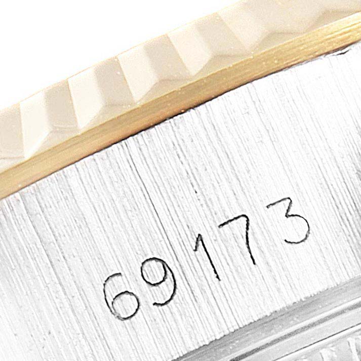 The image shows a close-up of the case side and fluted bezel of a Rolex Datejust 69173  Women
s Steel and Gold (two tone) Champagne Dial 69173  Women
s Steel and Gold (two tone) Champagne Dial model, with the watch
s reference number 69173.