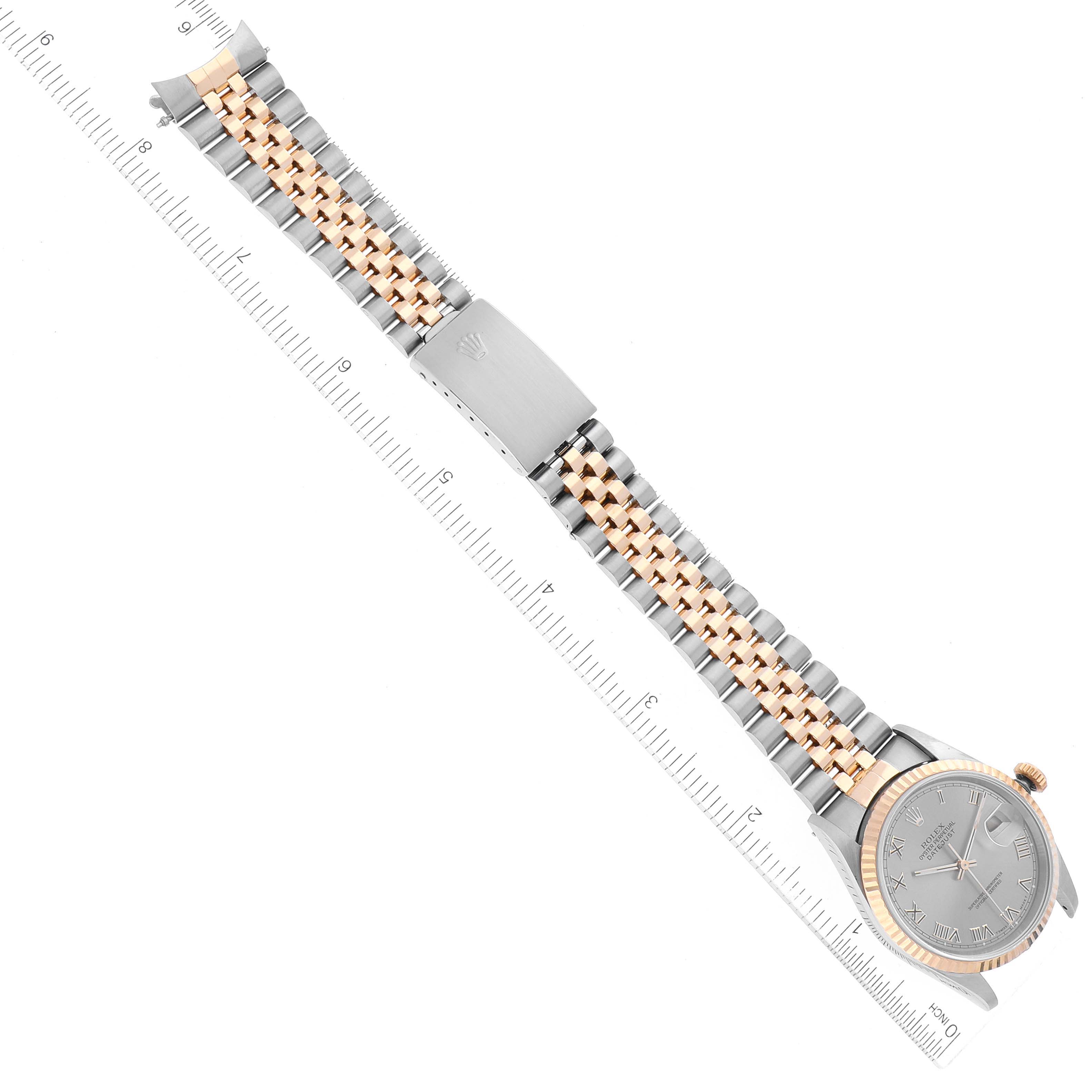 The image shows a Rolex Datejust 16233 Men's Steel and Gold (two tone) Grey Dial 16233 Men's Steel and Gold (two tone) Grey Dial watch laid flat with its bracelet and clasp extended, including a ruler for scale.