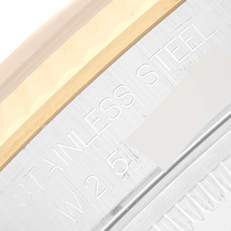 The image shows a close-up of the case back and edge of the bezel of a Rolex Datejust 16233 Men's Steel and Gold (two tone) Grey Dial 16233 Men's Steel and Gold (two tone) Grey Dial, highlighting the "Stainless Steel" inscription.