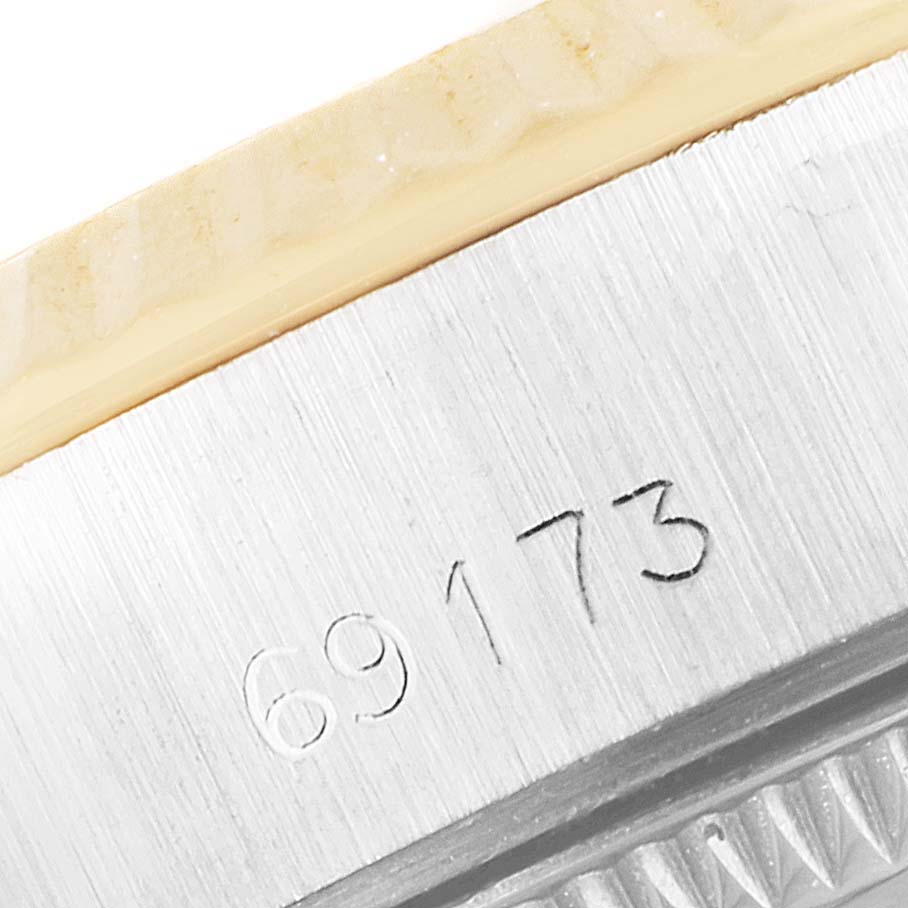 This image shows a close-up of the model number 69173 engraved on the bezel of a Rolex Datejust 69173 Women's Steel and Gold (two tone) White Dial 69173 Women's Steel and Gold (two tone) White Dial watch.