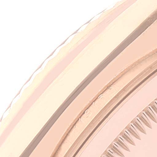 The image shows a close-up of the bezel, case edge, and fluted design of a Rolex President 118135 Men's Rose Gold Silver Dial 118135 Men's Rose Gold Silver Dial model watch.