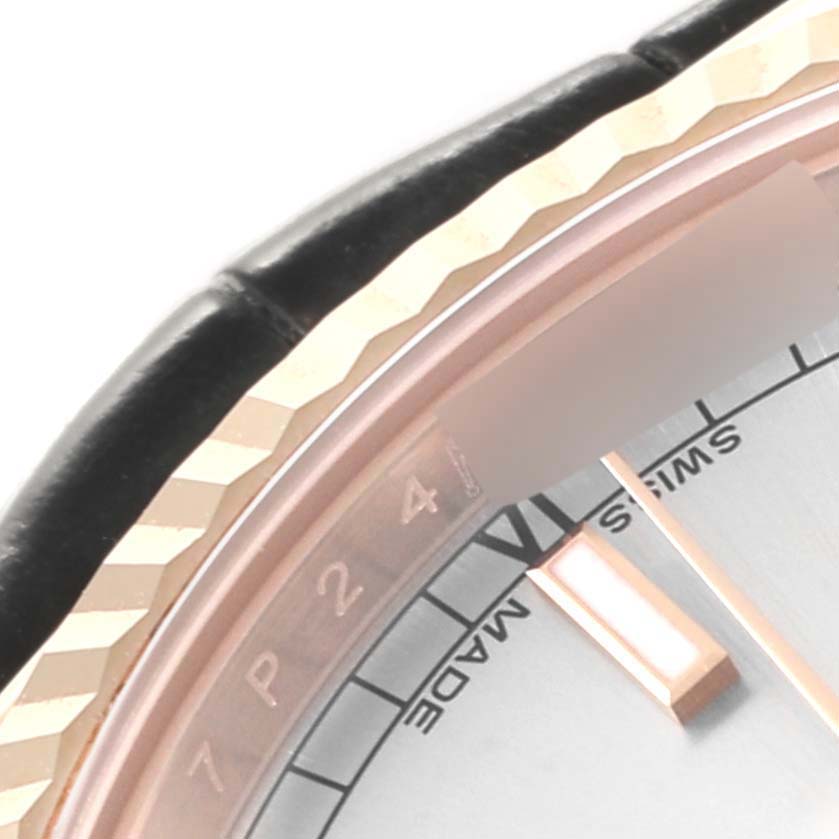 This image shows a close-up of the bezel, case, and part of the dial of a Rolex President 118135 Men's Rose Gold Silver Dial 118135 Men's Rose Gold Silver Dial model watch.