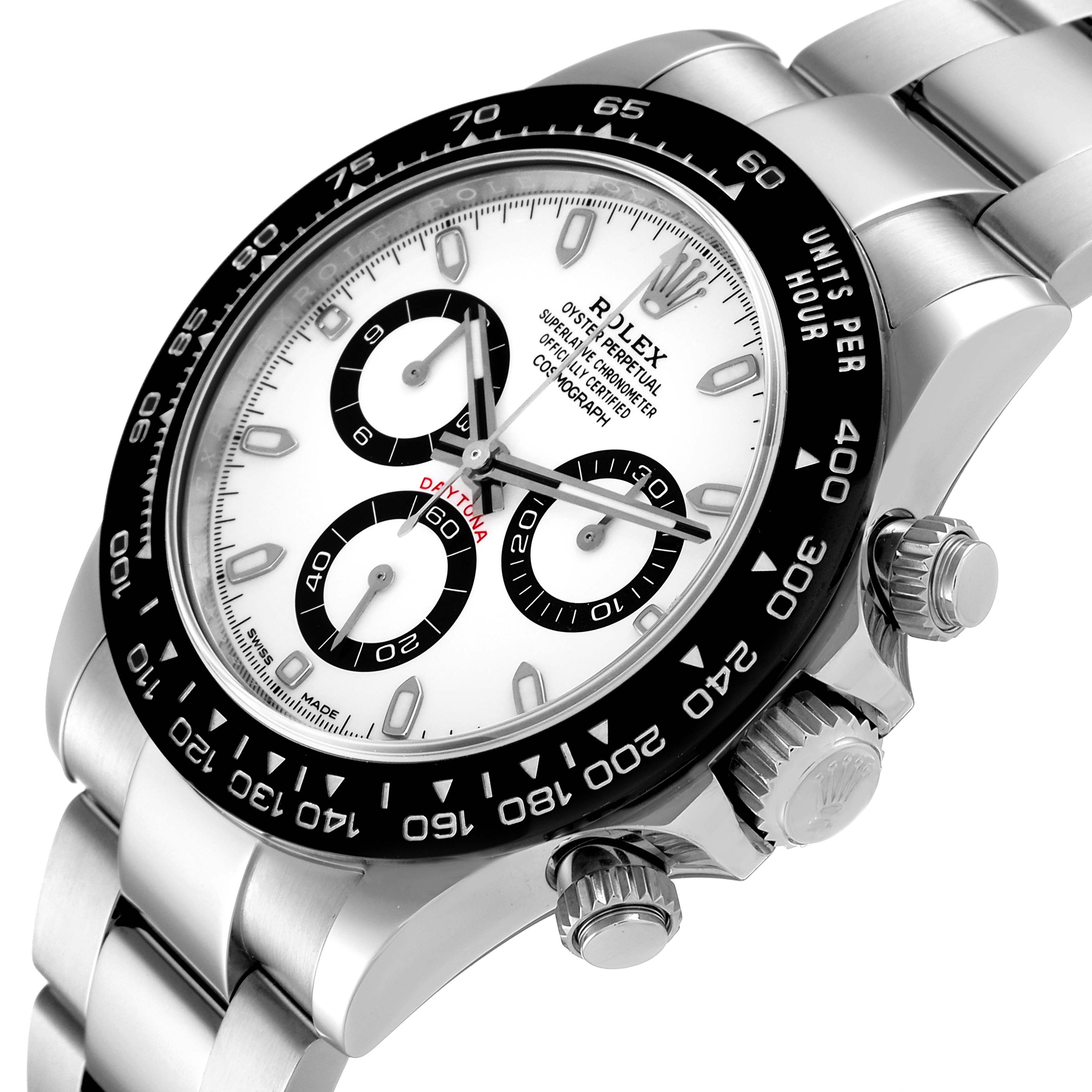 The image shows a close-up, angled view of the Rolex Daytona 116500 Men's Stainless Steel White Dial 116500 Men's Stainless Steel White Dial watch focusing on its face, bezel, and side controls.