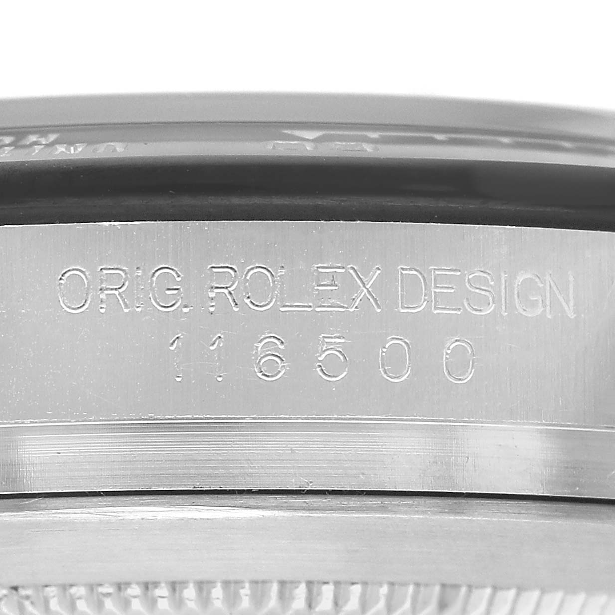 The image shows the side engraving of a Rolex Daytona 116500LN Men's Stainless Steel White Dial, displaying "ORIG ROLEX DESIGN" and the model number 116500.