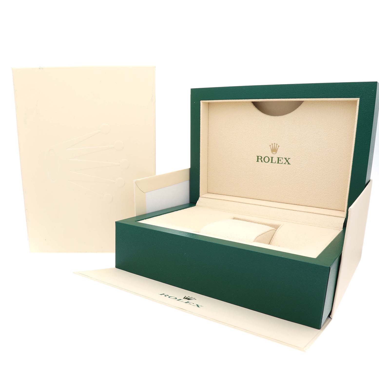 The image shows the opened green Rolex box for the Daytona model, with accompanying packaging materials.