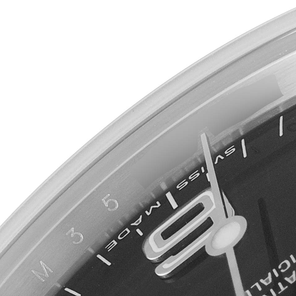 The close-up angle shows part of the dial and hands of a Rolex Explorer 114270 Men's Stainless Steel Black Dial 114270 Men's Stainless Steel Black Dial watch, focusing on the "9" marker and "Swiss Made" text.
