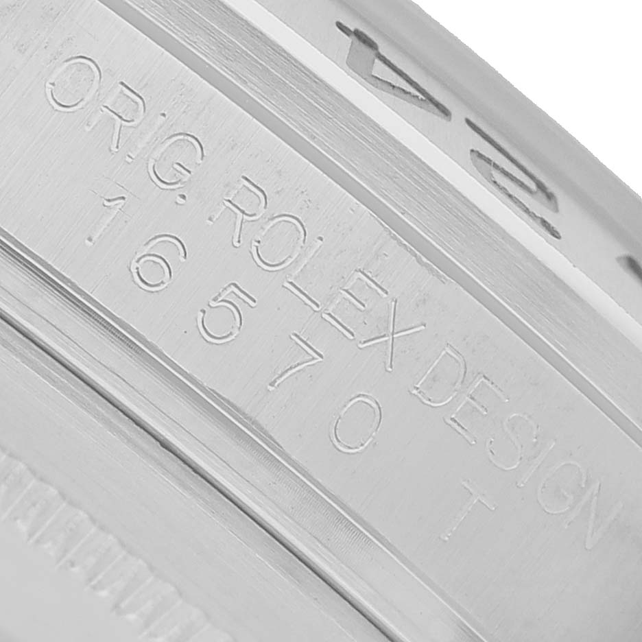 The Rolex Explorer 16570 T Men's Stainless Steel Black Dial watch is shown from an angle capturing the engraved casing with "ORG. ROLEX DESIGN" and model number "16570."