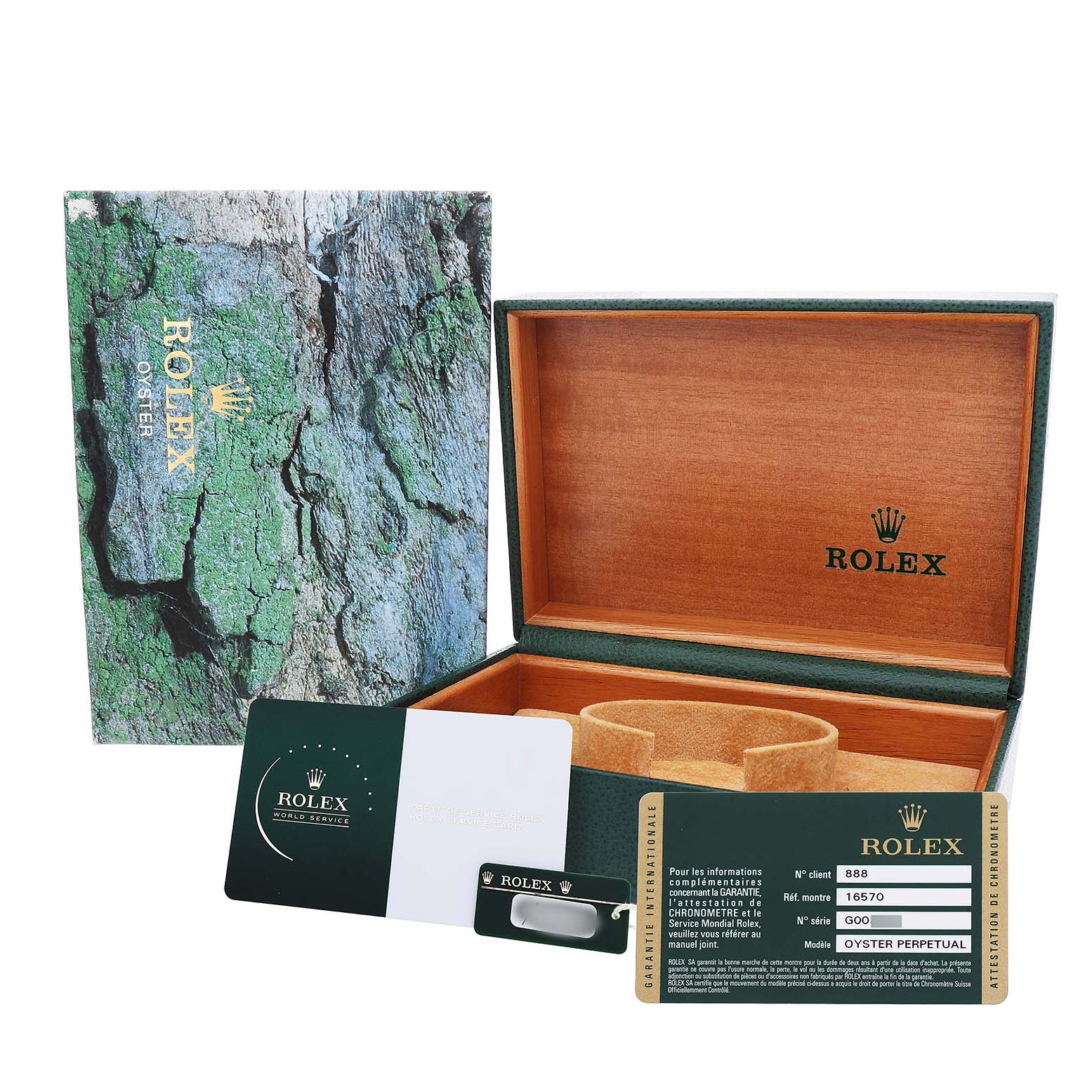 The image shows the packaging, inner box, and warranty card of a Rolex Explorer 16570 T Men's Stainless Steel Black Dial watch, viewed from above.