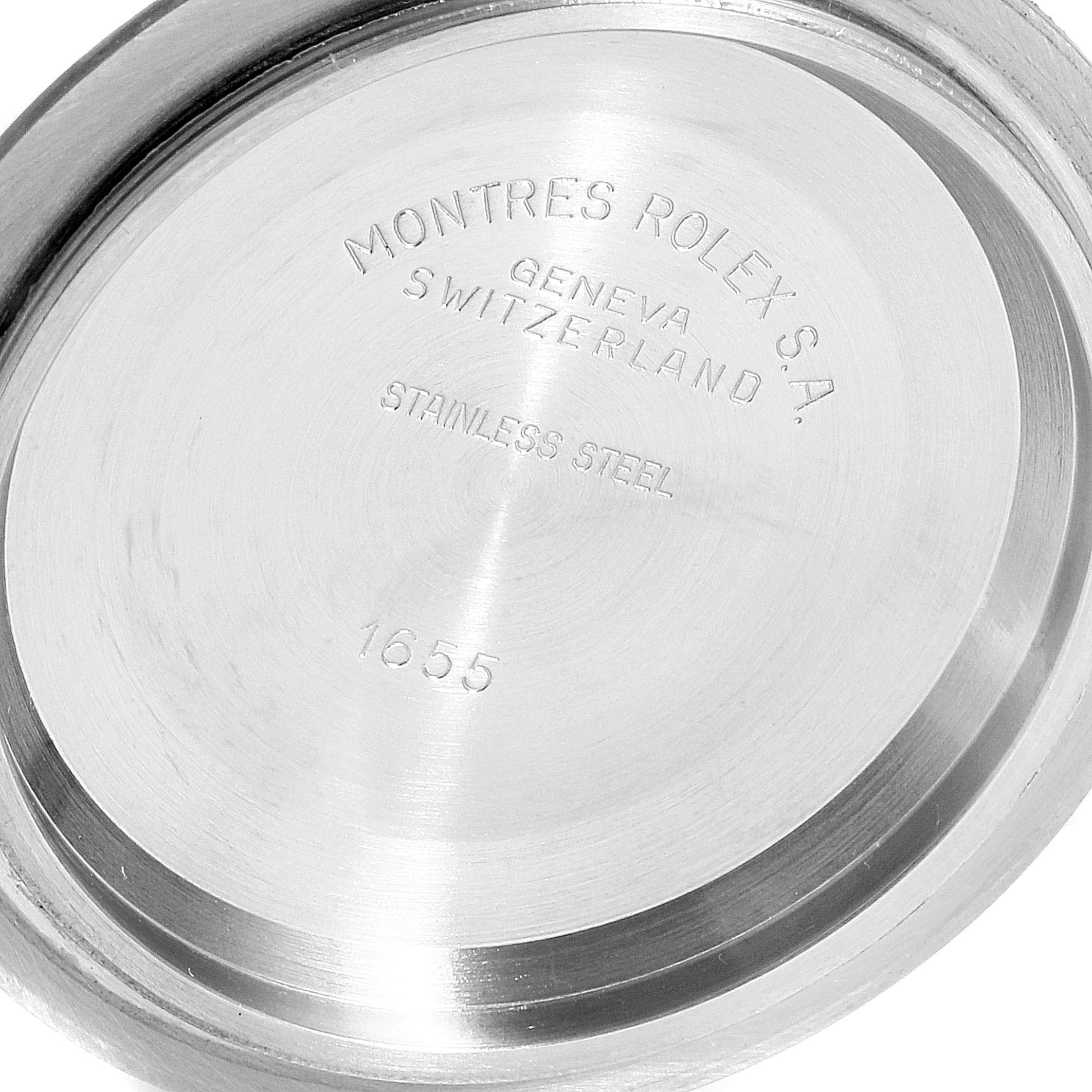This is a close-up of the back case of a Rolex Explorer 1655 Men's Stainless Steel Black Dial 1655 Men's Stainless Steel Black Dial watch, showing engravings and model number 1655.