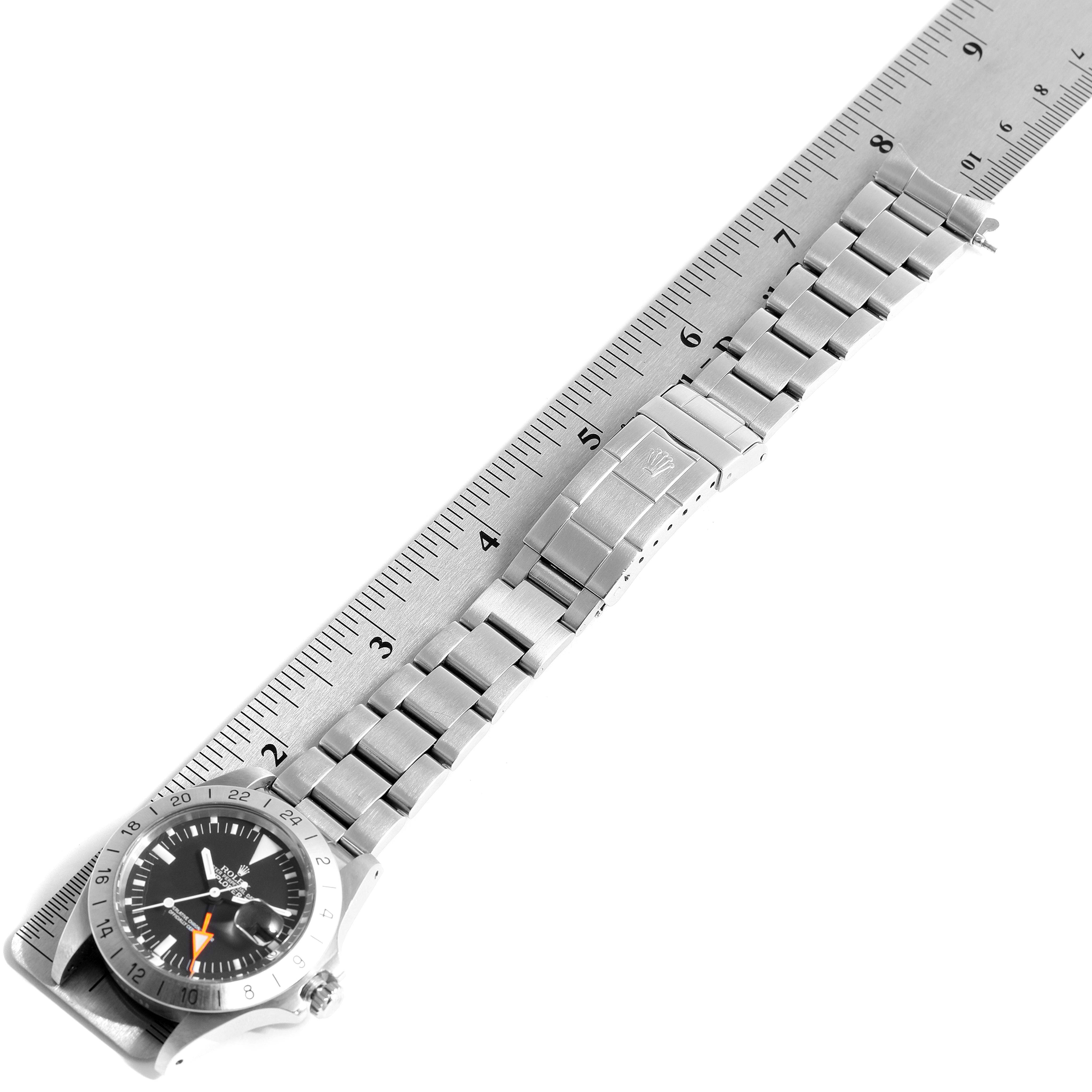 The image shows a Rolex Explorer 1655 Men's Stainless Steel Black Dial 1655 Men's Stainless Steel Black Dial watch model laid flat with its bracelet extended alongside a ruler for measurement.