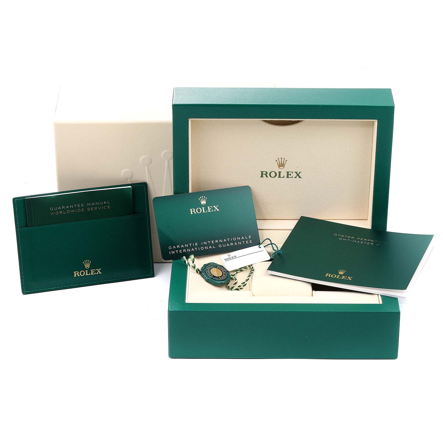 The image shows the packaging and accessories for a Rolex GMT-Master 126710 Men
s Stainless Steel Black Dial 126710 Men
s Stainless Steel Black Dial, including a green box, manuals, and guarantee card.