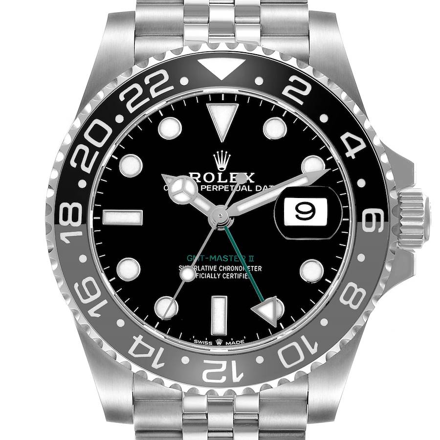 The Rolex GMT-Master watch is shown from the front, highlighting the bezel, dial, hands, and date window.