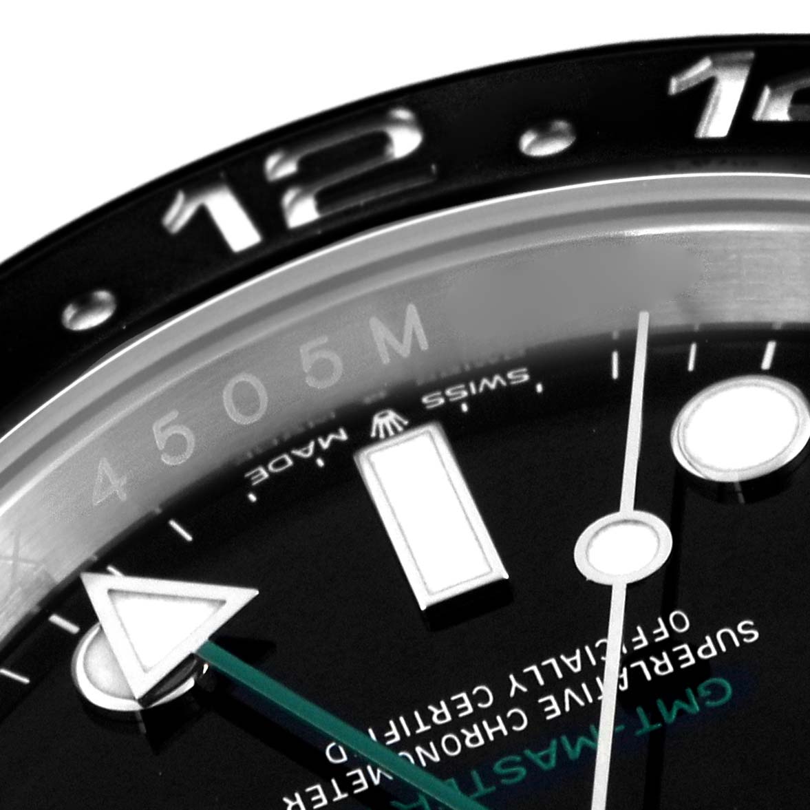 The image shows a close-up of the bezel and dial of a Rolex GMT-Master 126710 Men
s Stainless Steel Black Dial 126710 Men
s Stainless Steel Black Dial watch, highlighting the 12-hour mark and indicators.