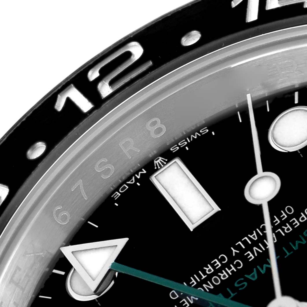 The image shows a close-up of the dial and bezel of a Rolex GMT-Master 126710 Men
s Stainless Steel Black Dial 126710 Men
s Stainless Steel Black Dial, focusing on the 12-hour marker and hands.