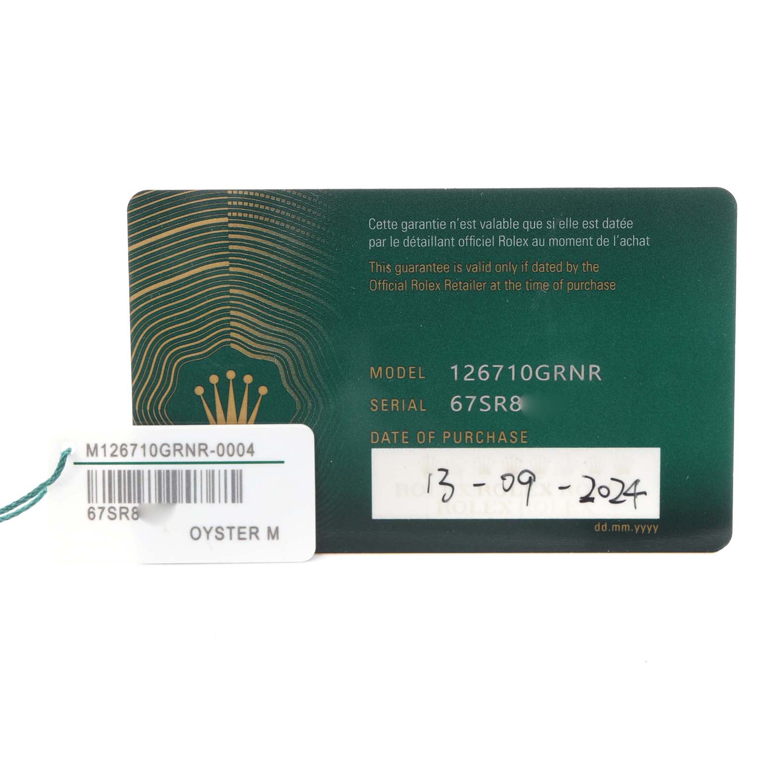 The image shows a warranty card and tag for the Rolex GMT-Master 126710 Men
s Stainless Steel Black Dial 126710 Men
s Stainless Steel Black Dial model 126710GRNR.