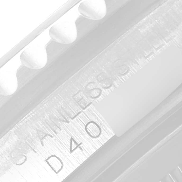 The image shows a close-up angle of the bezel and serial number engraving on a Rolex GMT-Master 16710 Men's Stainless Steel Black Dial 16710 Men's Stainless Steel Black Dial watch.