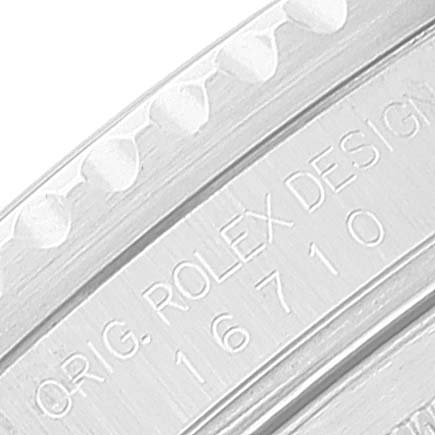 This image shows a close-up of the case side engraving on a Rolex GMT-Master 16710 Men
s Stainless Steel Black Dial 16710 Men
s Stainless Steel Black Dial model, displaying "ORIG. ROLEX DESIGN 16710".