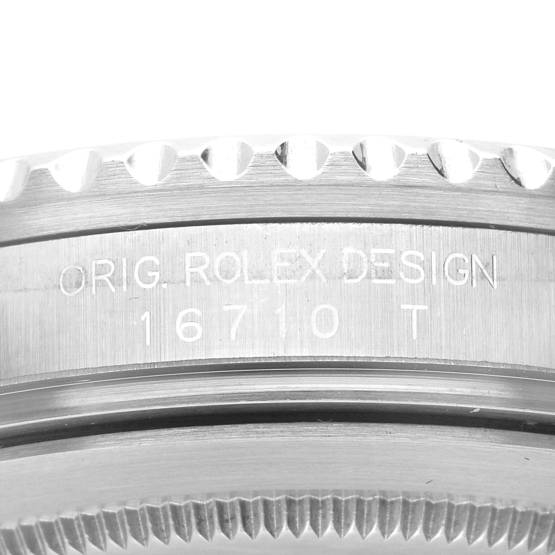 The image shows a close-up of the side profile of the bezel and case of a Rolex GMT-Master 16710 Men's Stainless Steel Black Dial 16710 Men's Stainless Steel Black Dial model, including engravings.