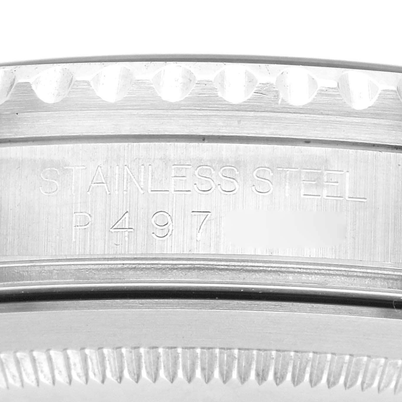 The image shows the side view of a Rolex GMT-Master 16710 Men
s Stainless Steel Black Dial 16710 Men
s Stainless Steel Black Dial, focusing on the stainless steel case with engraved serial number details.